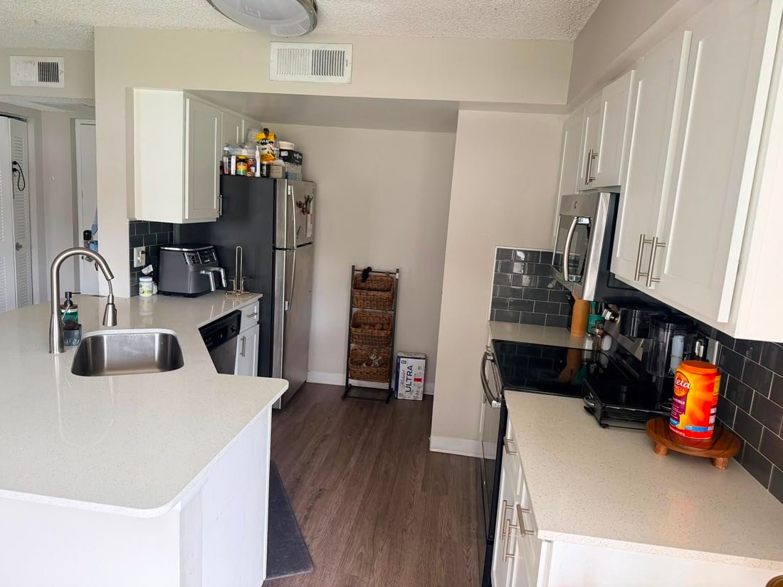 White kitchen with island after cleaning