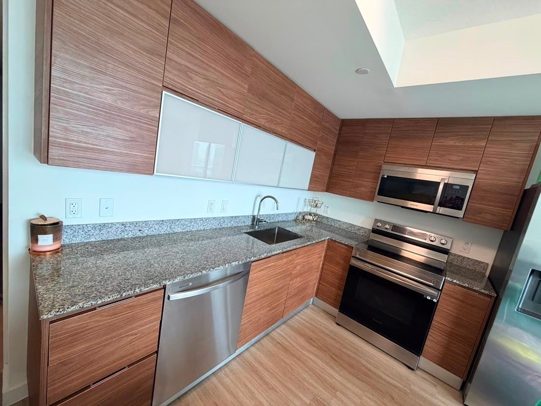 Spotless modern kitchen with wood cabinets